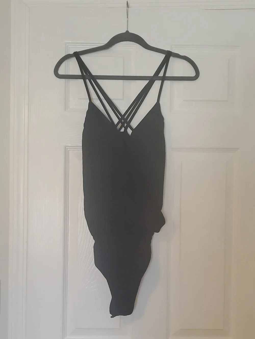 Black Strappy Cross-Back One-Piece Bodysuit